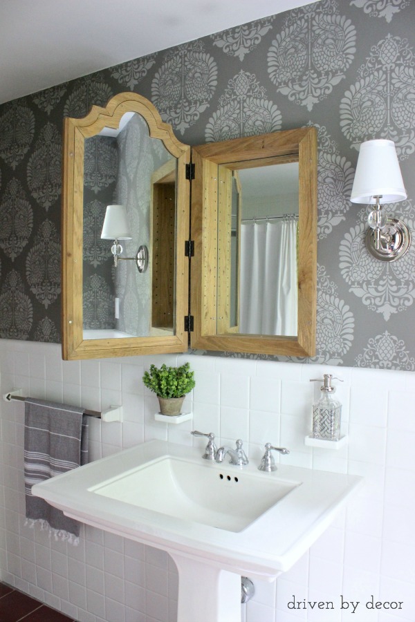 Love this wood mirrored medicine chest and the stenciled walls in this gray and white bathroom kellyelko.com