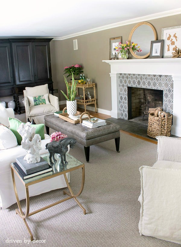 Neutral living room with color from flowers and accessories kellyelko.com