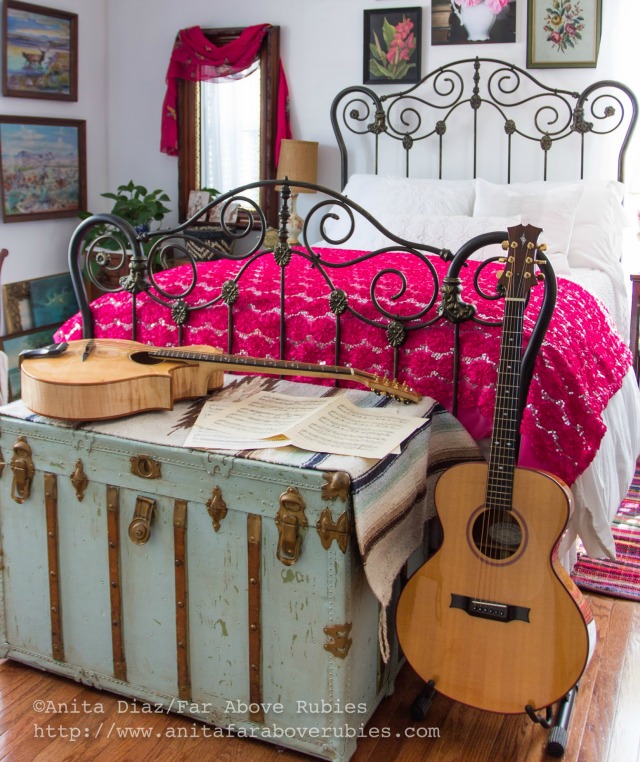 Boho bedroom with antique iron bed and vintage footlocker trunk kellyelko.com