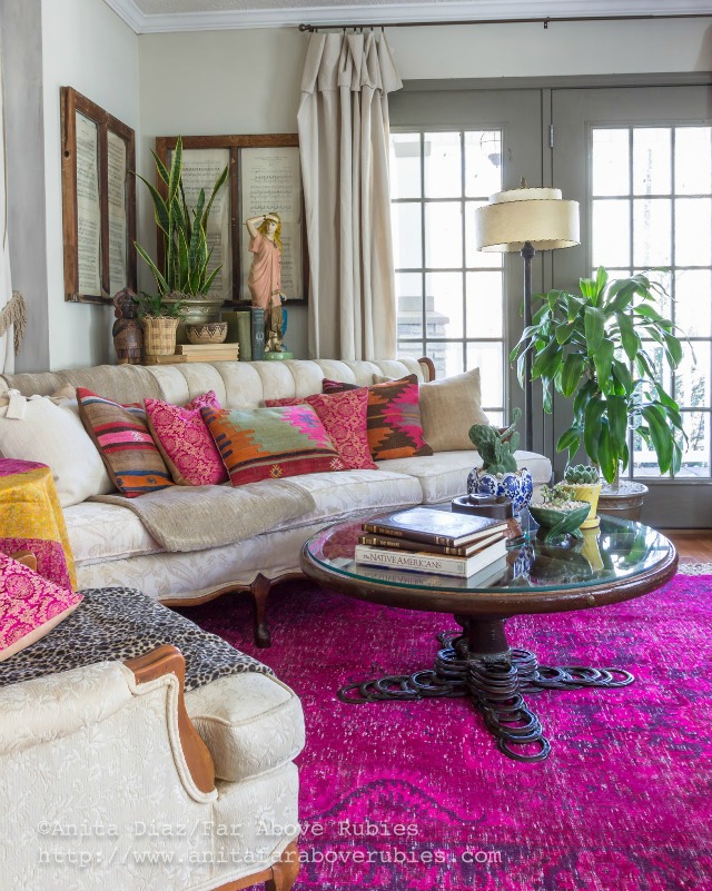 Colorful boho family room - love the over dyed pink rug kellyelko.com