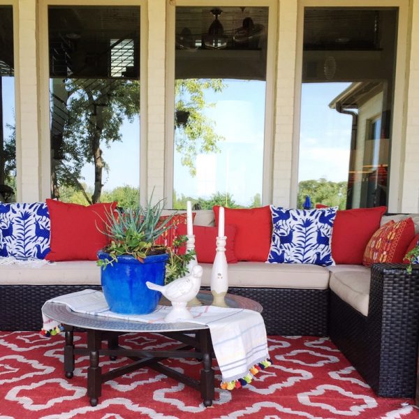 Colorful patio with comfortable sofa and Moroccan tray table kellyelko.com