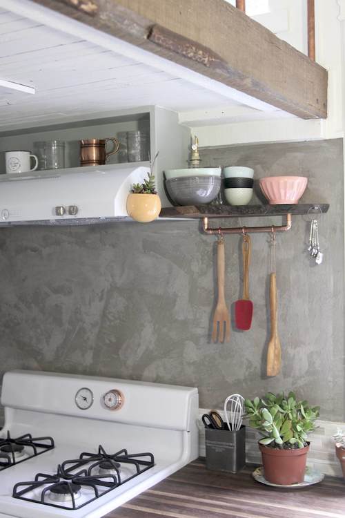 Love the concrete walls in this cool kitchen kellyelko.com