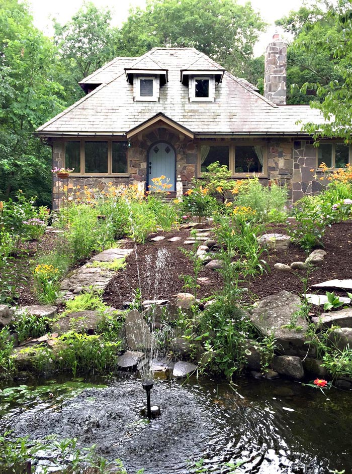 Stone cottage with lush gardens - love the fountain kellyelko.com