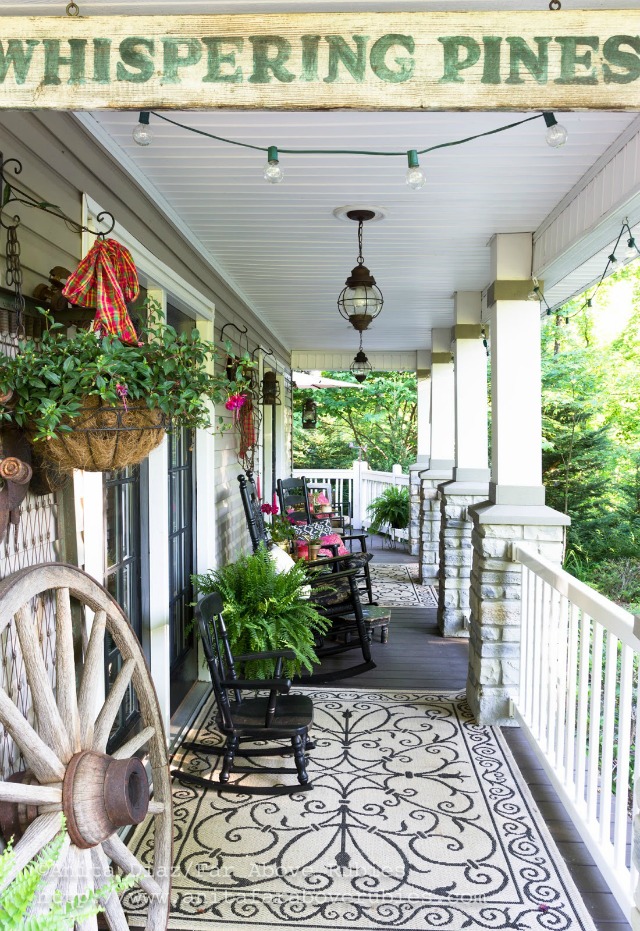 Welcoming front porch - love the antique wood sign an the black rocking chairs kellyelko.com
