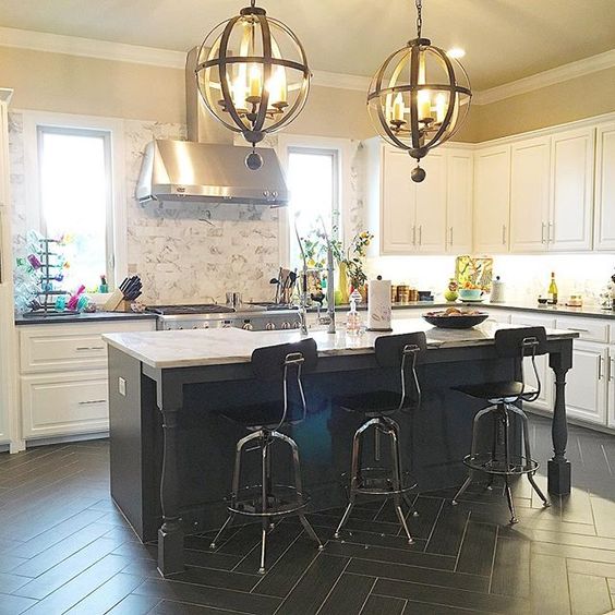 Black kitchen floors with marble backsplash and white cabinets is perfection! kellyelko.com