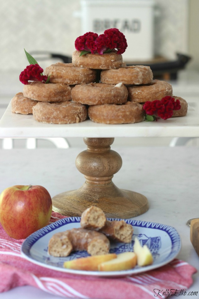 Doughnut tower with flowers - love this for a party! kellyelko.com