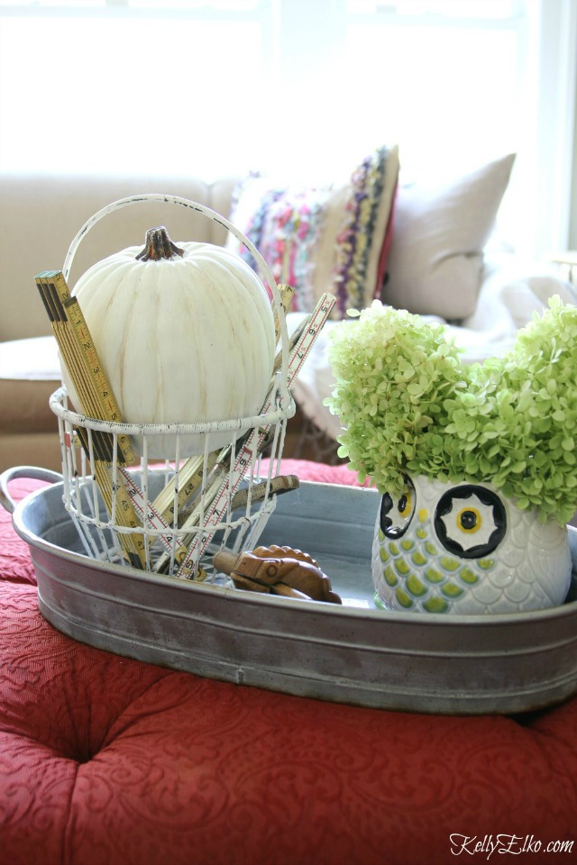 Fall centerpiece - love the bucket of vintage folding rulers and the owl vase kellyelko.com