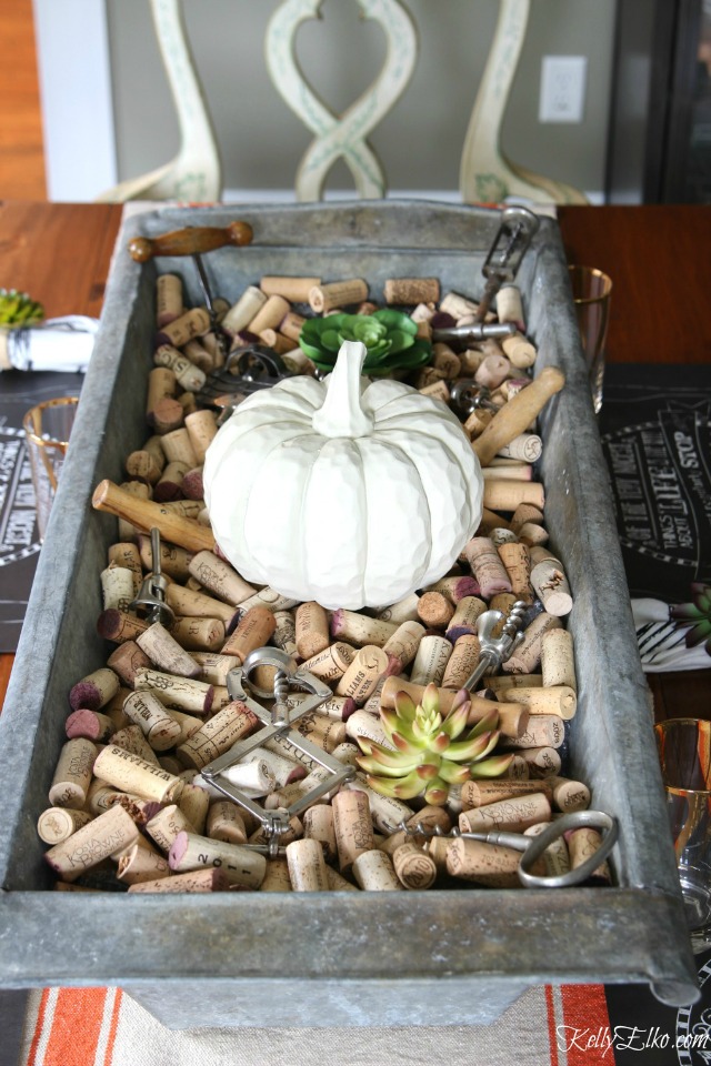 Love this giant zinc trough filled with corks for a fun fall centerpiece kellyelko.com