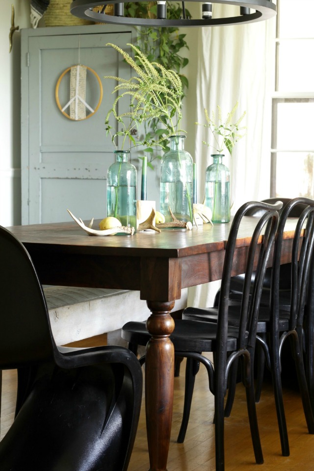 Fall dining room - love the simple centerpiece of vintage glass bottles filled with weeds kellyelko.com