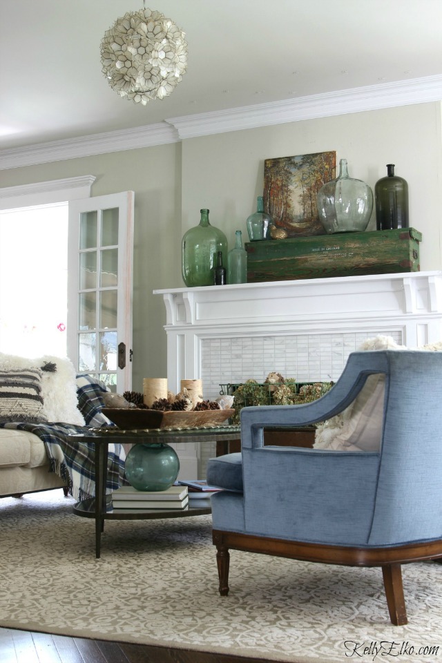 Fall living room - love the glass demijohn collection on the mantel kellyelko.com