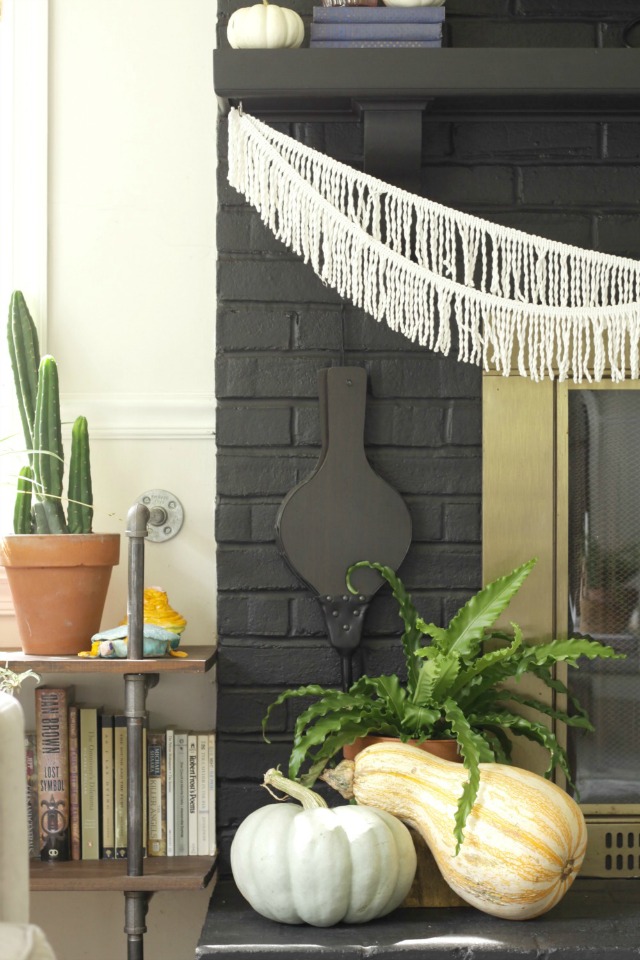 Love the fringe banner on this boho mantel kellyelko.com