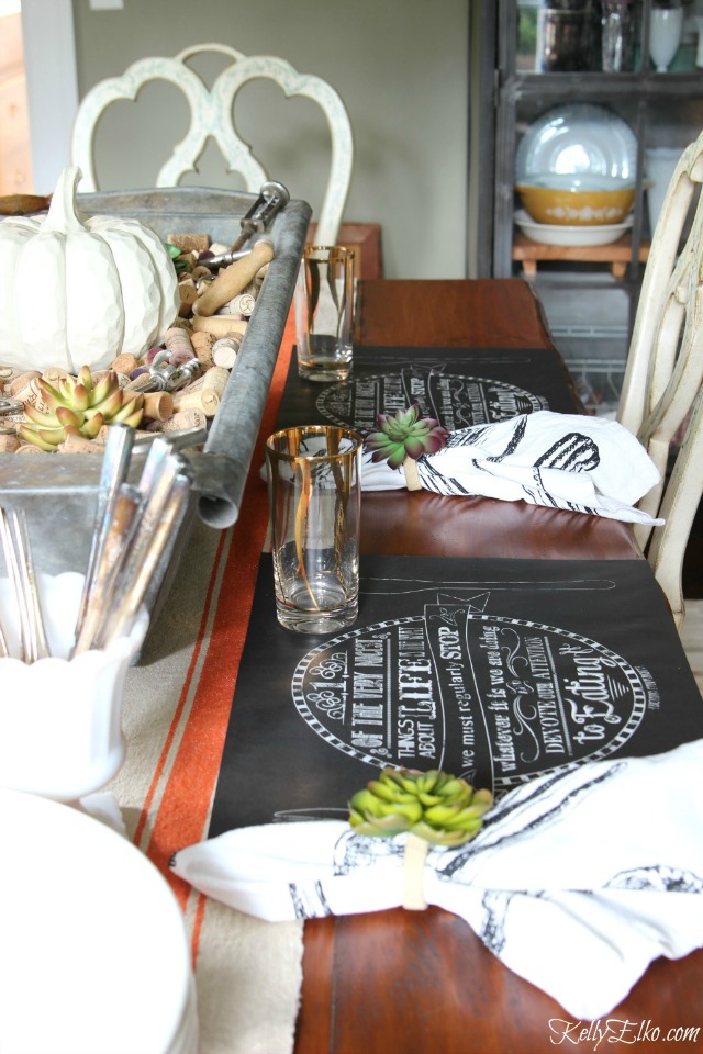 Gorgeous fall table setting - love the chalkboard placemats and cork centerpiece! kellyelko.com