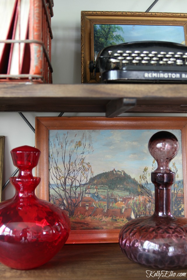 Layer paintings and vintage finds on open shelves kellyelko.com