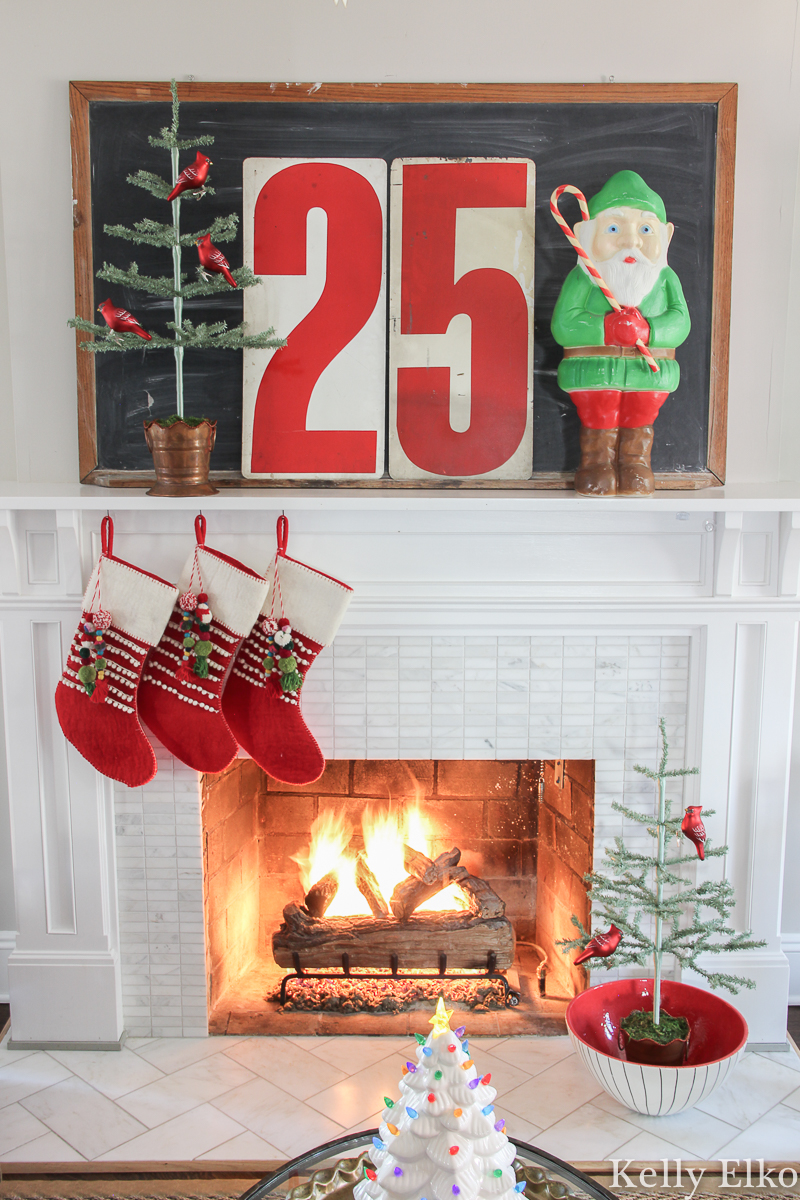 https://www.kellyelko.com/wp-content/uploads/2020/11/vintage-christmas-mantel-elf-blow-mold-fireplace-feather-tree-chalkboard.jpg